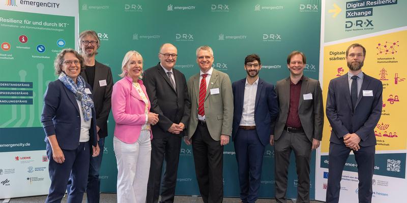 Group photo in front of a wall