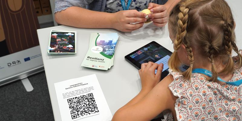 Child in front of a tablet testing the game