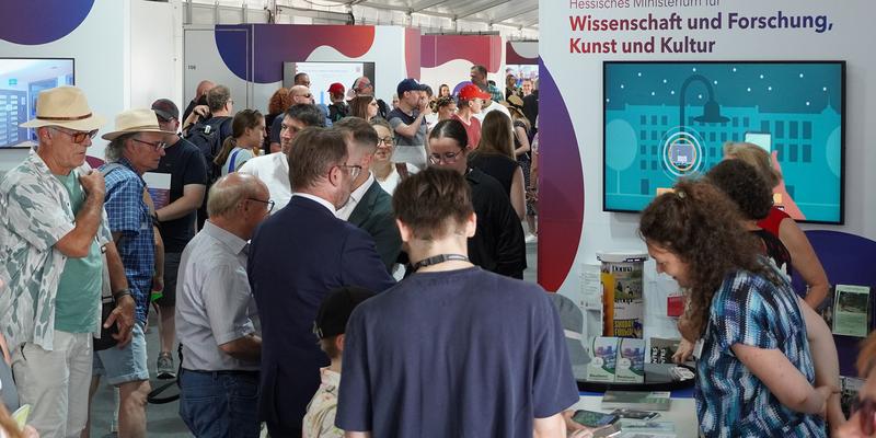 Visitors to an exhibition stand at the Hessentag in Bad Vilbel.