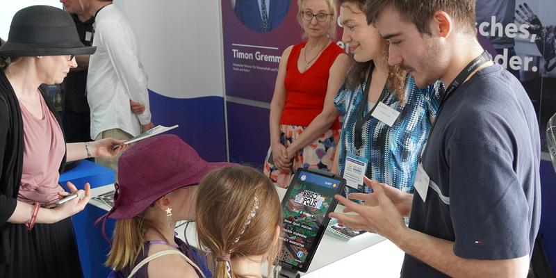Visitors to an exhibition stand at the Hessentag in Bad Vilbel.