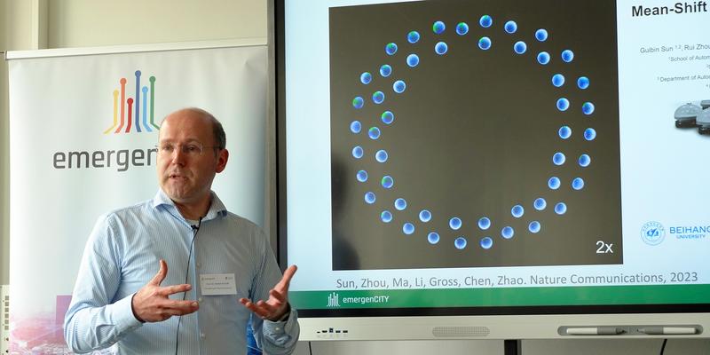 A Professors gives a talk abour swarm robotics.